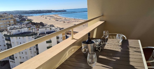 Beach front, one bedroom air-conditioned, top floor apartment with sea views